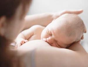 Newborn breastfeeding with mother, expert lactation support in Philadelphia.